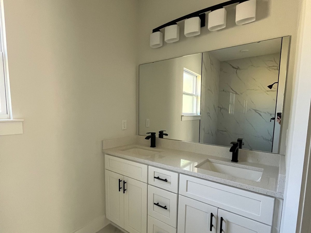 Finished bathroom with double vanity
